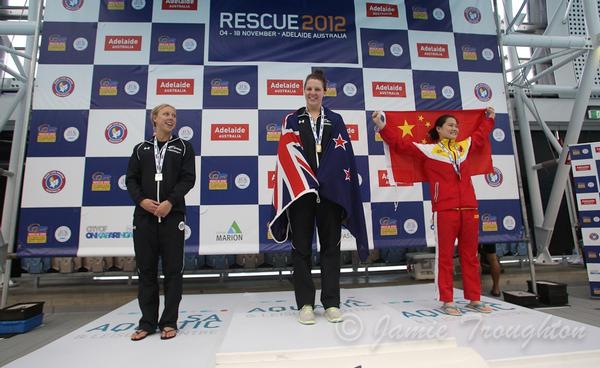 Samantha Lee (centre) with her 200m obstacles gold medal and teammate Natasha Hind (left) with her silver. 